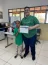 Aluna do Projeto Seara de Luz e Gustavo Carmona Chinalli, monitor do programa, na formatura do Programa Flix