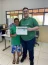 Aluno do Projeto Seara de Luz e Gustavo Carmona Chinalli, monitor do programa, na formatura do Programa Flix