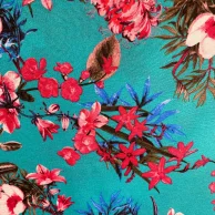tecido gorgurinho folhagem e flor fundo azul.jpg