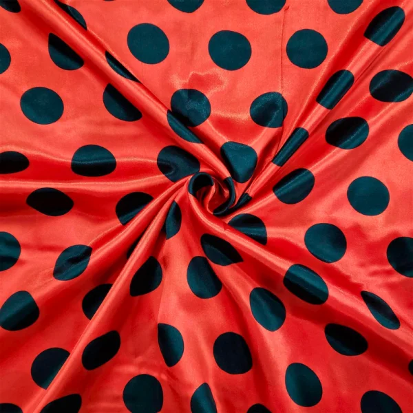 tecido cetim estampado vermelho com bola preta.png