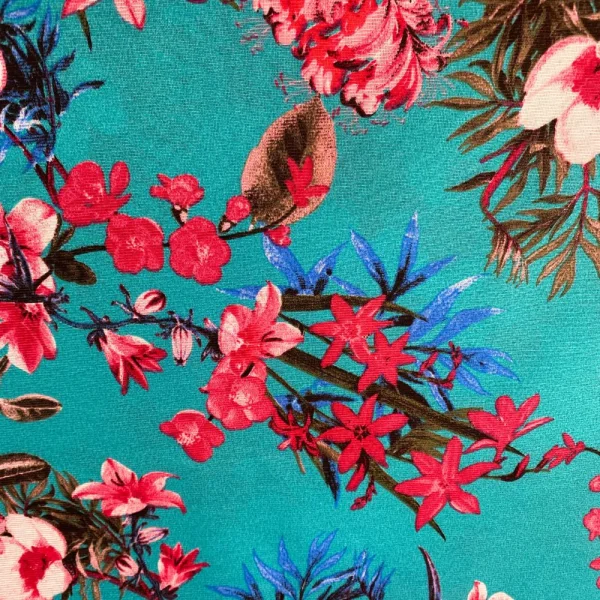 tecido gorgurinho folhagem e flor fundo azul.jpg