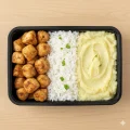 Coxa e sobrecoxa, arroz e pur� de batata (400g)