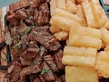 Por��o de Carne de sol com macaxeira (farofa, vinagrete e molho da casa)