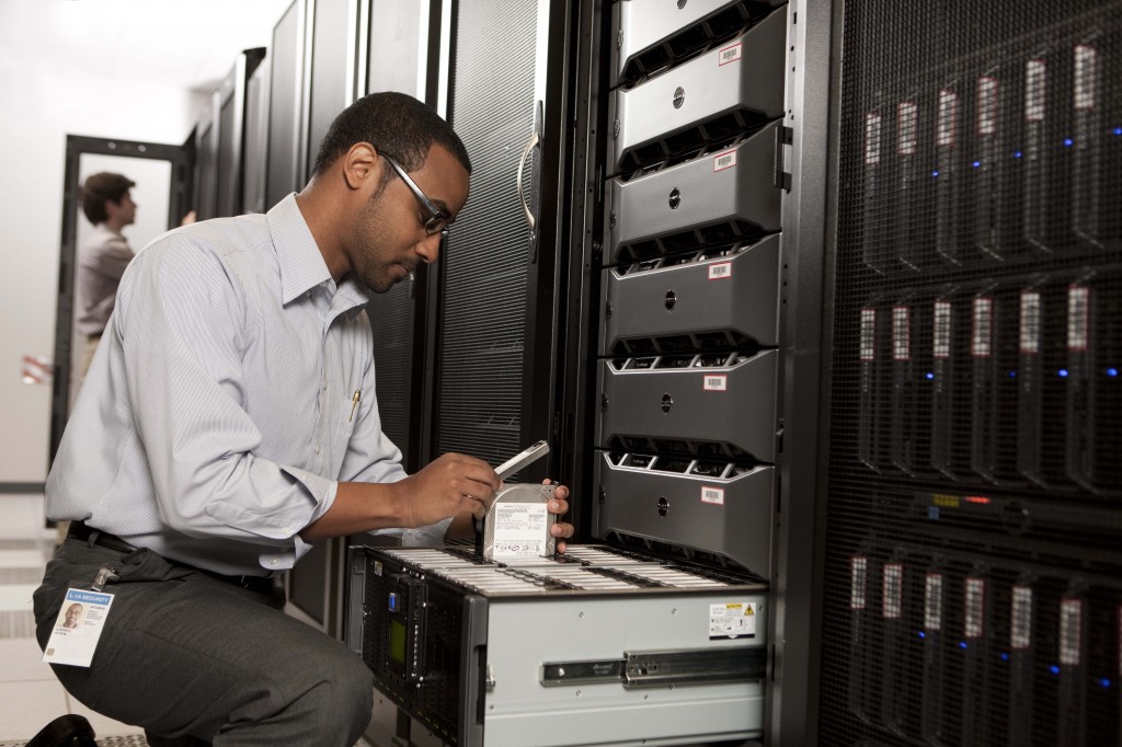 Man in front of Dell Rack Servers